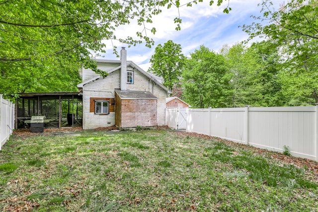 63 Viola Rd, Suffern, NY 10901 - view of yard featuring a fenced backyard and a sunroom