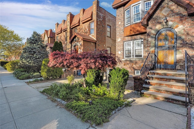 view of front of home with brick siding