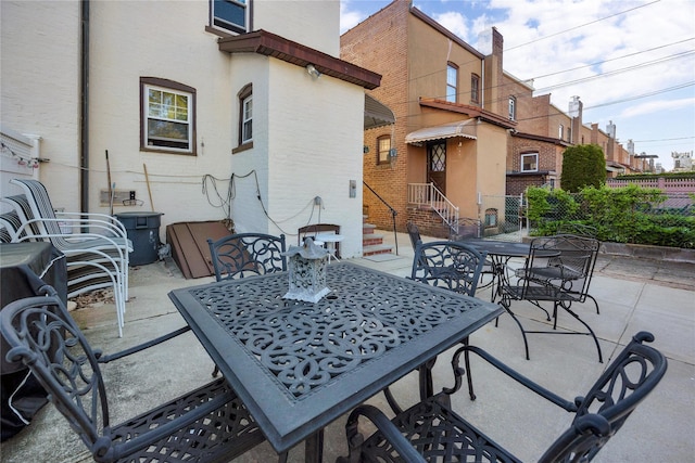 view of patio / terrace featuring outdoor dining area and fence