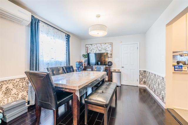 dining area featuring baseboards, a wall mounted air conditioner, and dark wood-style floors