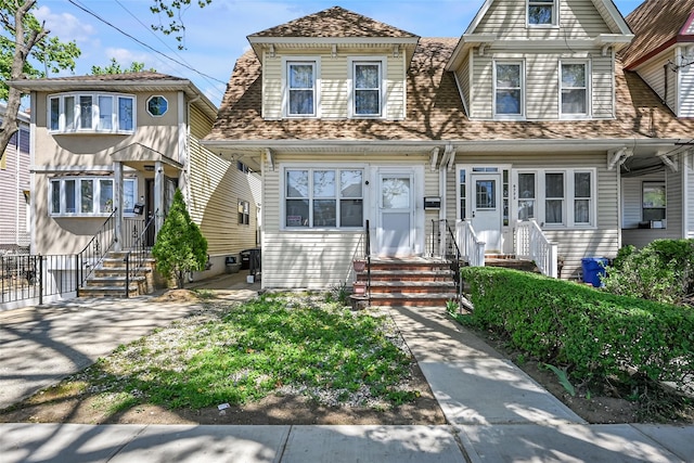87-71 111th St, Richmond Hill, NY 11418 - view of front facade with a shingled roof and entry steps