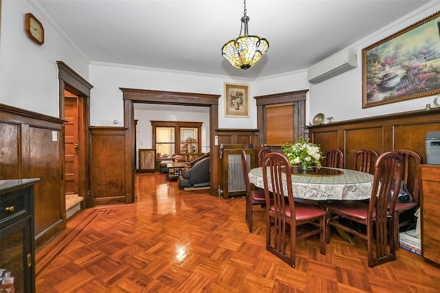 87-71 111th St, Richmond Hill, NY 11418 - dining space with crown molding, a wall unit AC, and a wainscoted wall