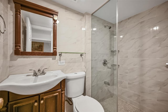 87-71 111th St, Richmond Hill, NY 11418 - bathroom with toilet, tile walls, a tile shower, and vanity