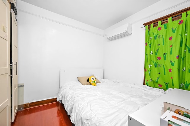 87-71 111th St, Richmond Hill, NY 11418 - bedroom featuring baseboards, wood finished floors, and a wall mounted air conditioner