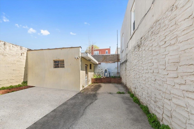 view of side of home with a patio area