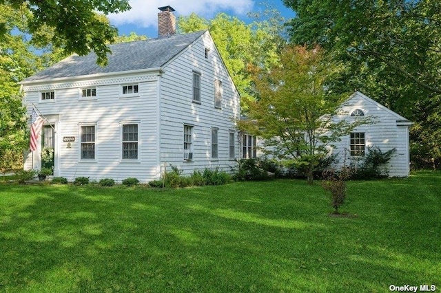 57020 Rte 25, Southold, NY 11971 - view of side of property with a lawn and a chimney