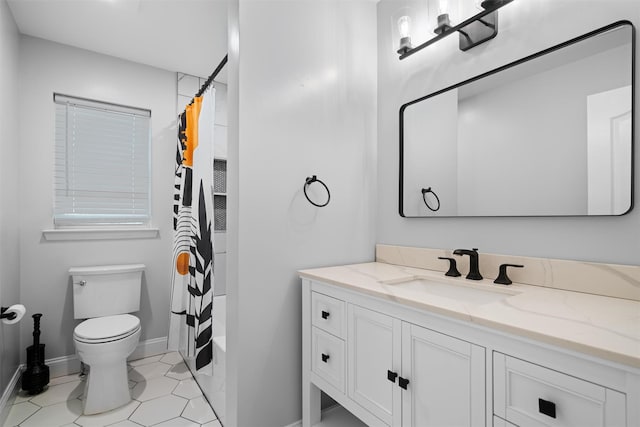 bathroom with tile patterned flooring, shower / bath combo, vanity, baseboards, and toilet