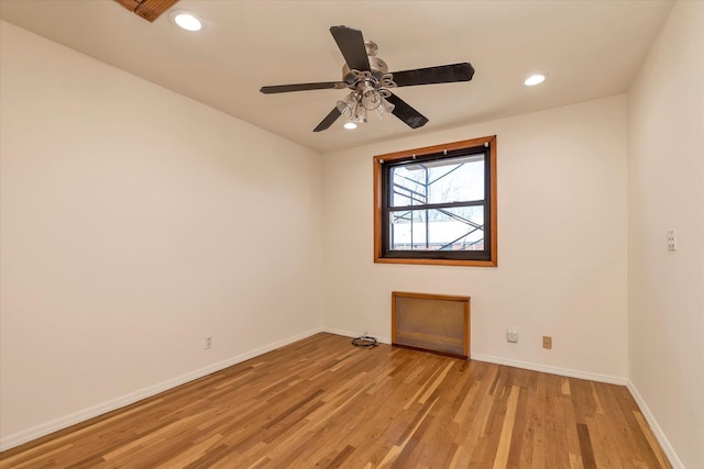 spare room with light wood-style floors, baseboards, a ceiling fan, and recessed lighting