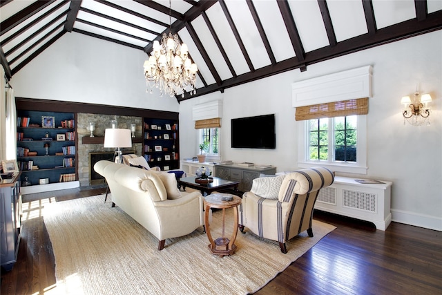 living room with healthy amount of natural light, a chandelier, wood finished floors, high vaulted ceiling, and baseboards