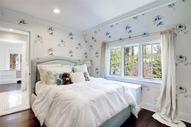 bedroom featuring ornamental molding, dark wood-style flooring, baseboards, recessed lighting, and wallpapered walls