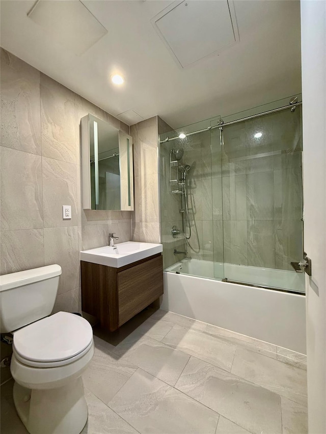 14-33 31st Ave Unit 4H, Astoria, NY 11106 - bathroom featuring enclosed tub / shower combo, toilet, tile walls, and vanity