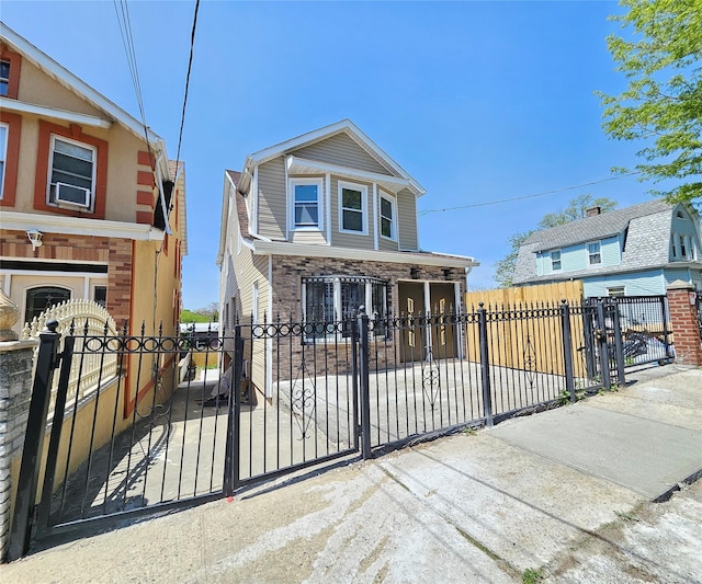 view of front of property with a gate and a fenced front yard