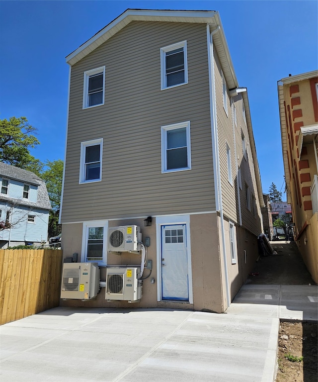 back of house with fence, ac unit, and a patio area