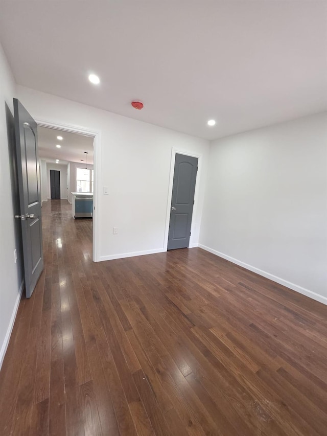 217 E 86th St, Brooklyn, NY 11236 - unfurnished room with dark wood-style flooring, baseboards, and recessed lighting