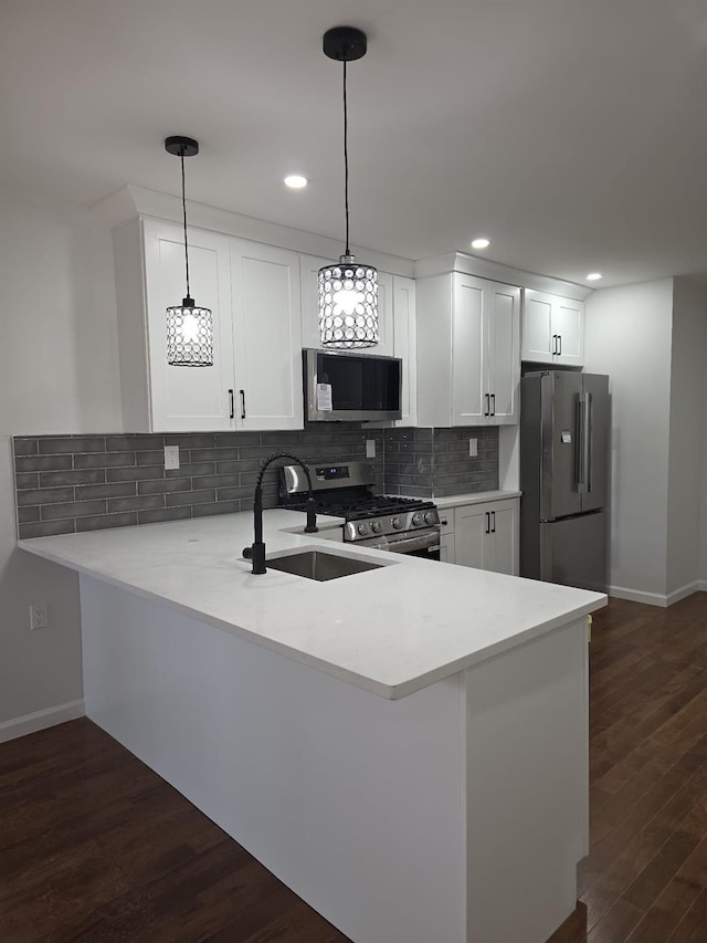 217 E 86th St, Brooklyn, NY 11236 - kitchen featuring appliances with stainless steel finishes, a sink, baseboards, light countertops, and recessed lighting