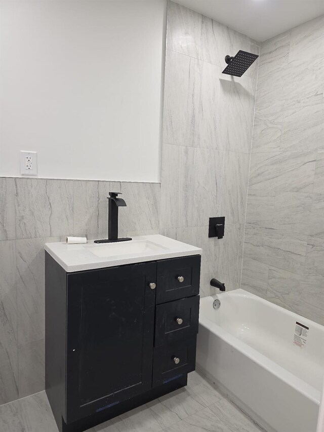 217 E 86th St, Brooklyn, NY 11236 - bathroom featuring tile walls, shower / tub combination, and vanity