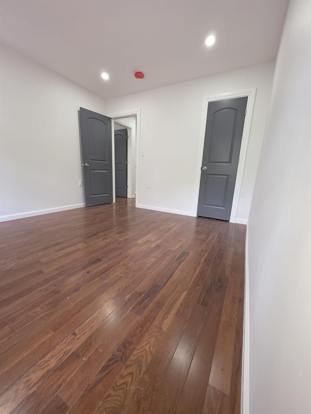 217 E 86th St, Brooklyn, NY 11236 - empty room featuring dark wood finished floors, baseboards, and recessed lighting