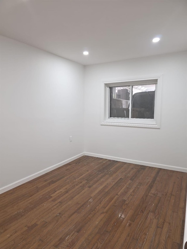 217 E 86th St, Brooklyn, NY 11236 - unfurnished room with baseboards, dark wood finished floors, and recessed lighting