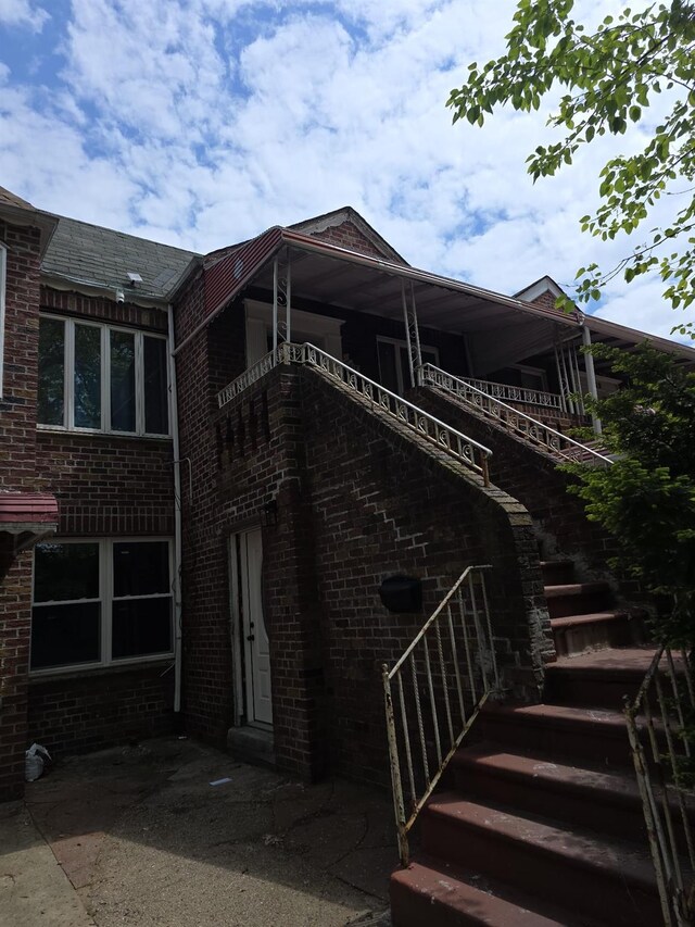 217 E 86th St, Brooklyn, NY 11236 - back of house with stairs and brick siding