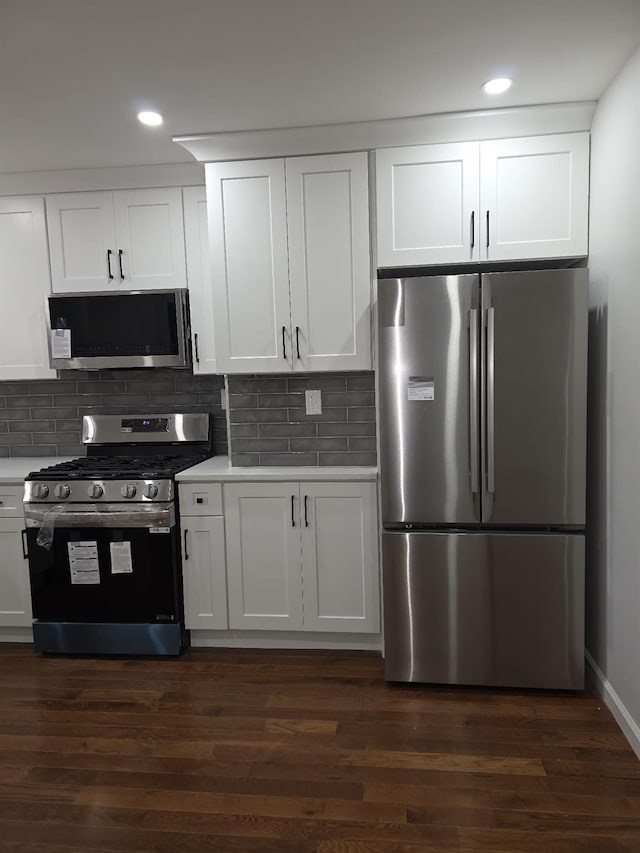 217 E 86th St, Brooklyn, NY 11236 - kitchen featuring stainless steel appliances, light countertops, white cabinetry, backsplash, and recessed lighting