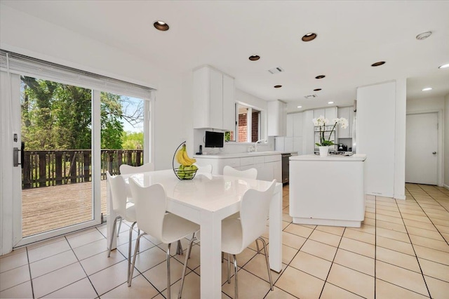 dining room with light tile patterned floors and visible vents