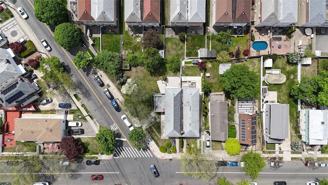 birds eye view of property with a residential view