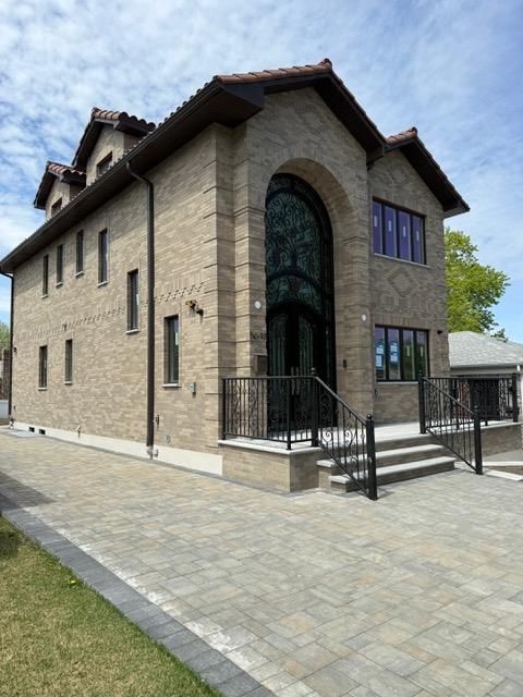 exterior space with a tile roof