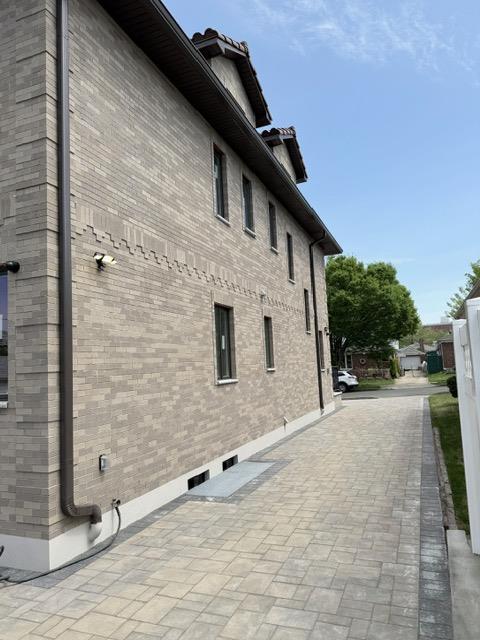 view of property exterior featuring brick siding
