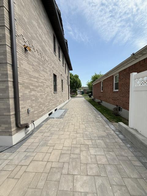 view of side of home with brick siding