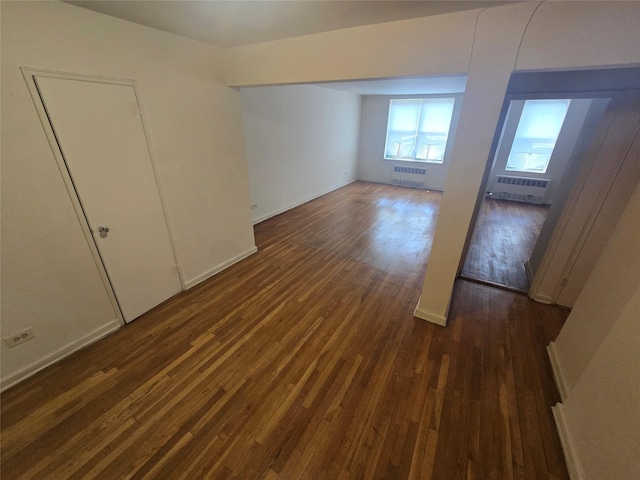 1475 Thieriot Ave Unit 4J, Bronx, NY 10460 - unfurnished bedroom featuring baseboards, radiator, and dark wood finished floors