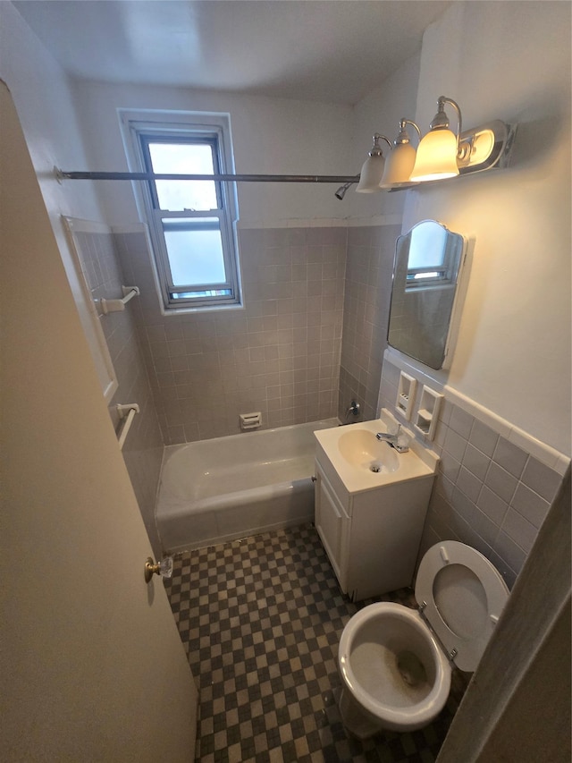1475 Thieriot Ave Unit 4J, Bronx, NY 10460 - bathroom featuring vanity, wainscoting, toilet, bathtub / shower combination, and tile patterned floors