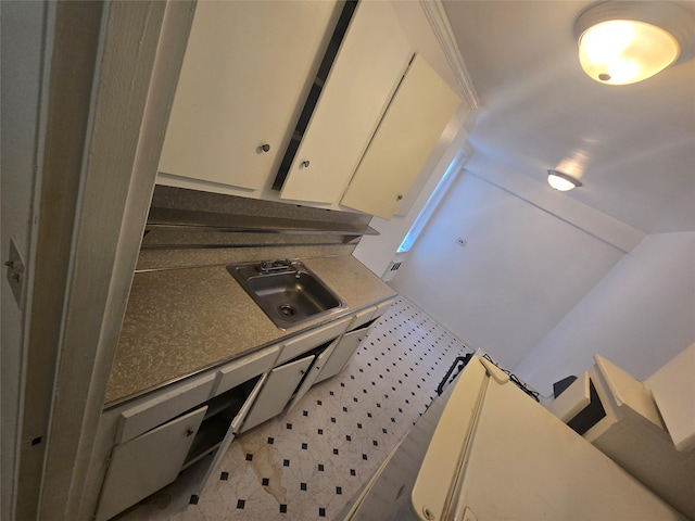 1475 Thieriot Ave Unit 4J, Bronx, NY 10460 - interior space featuring light floors, a sink, and white cabinetry