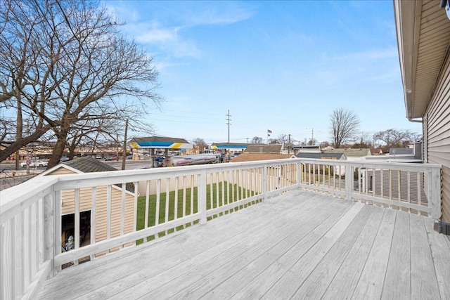 wooden deck featuring a yard