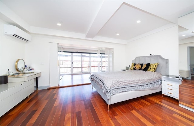 bedroom with beamed ceiling, an AC wall unit, recessed lighting, and wood finished floors