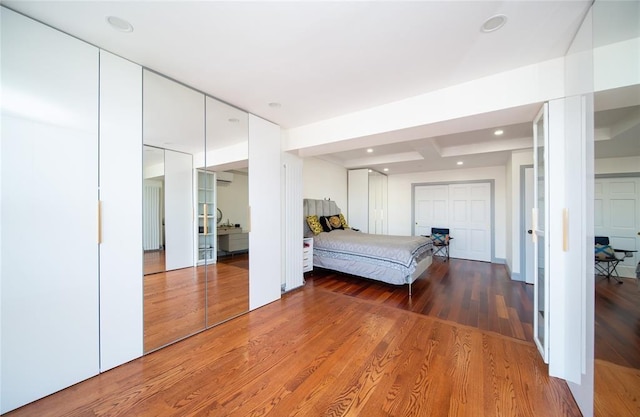 bedroom with recessed lighting and wood finished floors