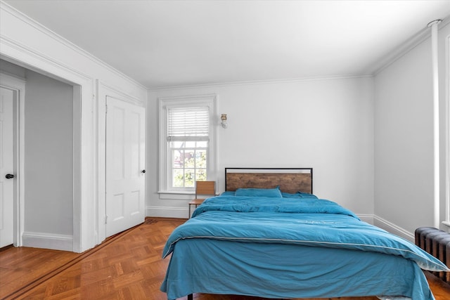 bedroom featuring baseboards, ornamental molding, and radiator heating unit