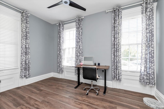 office area with baseboards, a ceiling fan, and wood finished floors