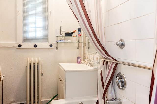 bathroom featuring vanity and radiator