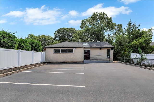 362 Mooney Pond Rd, Farmingville, NY 11738 - view of front of house featuring uncovered parking and fence
