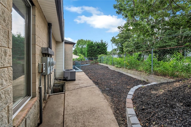 362 Mooney Pond Rd, Farmingville, NY 11738 - view of home's exterior with a fenced backyard, cooling unit, and a patio