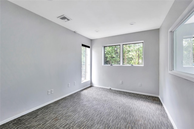 362 Mooney Pond Rd, Farmingville, NY 11738 - empty room with baseboards and dark colored carpet