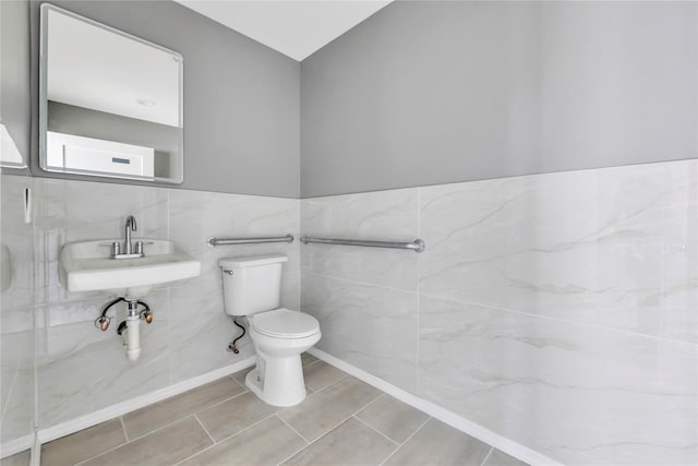 362 Mooney Pond Rd, Farmingville, NY 11738 - half bathroom with toilet, a sink, and tile walls