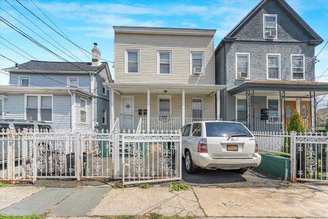 515 S 9th Ave, Mount Vernon, NY 10550 - view of front of property with a gate, a fenced front yard, and covered porch