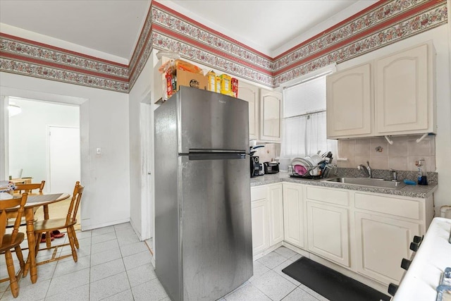 515 S 9th Ave, Mount Vernon, NY 10550 - kitchen with freestanding refrigerator, light tile patterned floors, and a sink