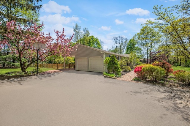 exterior space with fence and driveway