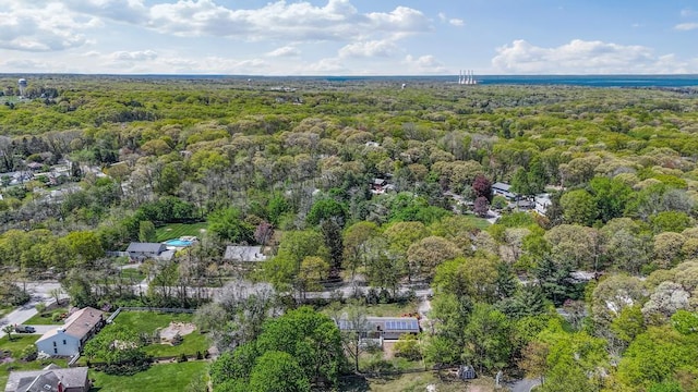 aerial view featuring a wooded view
