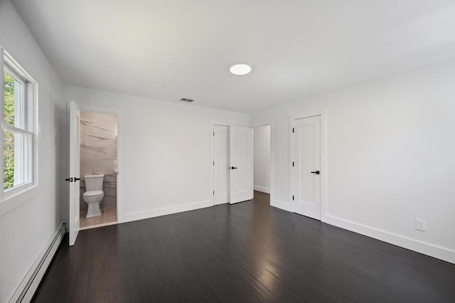 85 Meadow Glen Rd, Fort Salonga, NY 11768 - unfurnished bedroom featuring visible vents, a baseboard radiator, dark wood-style flooring, and baseboards