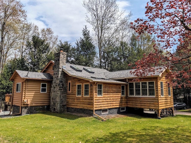 25 E Reindeer Trl, Bethel, NY 12778 - rear view of house with a yard, a chimney, and a shingled roof