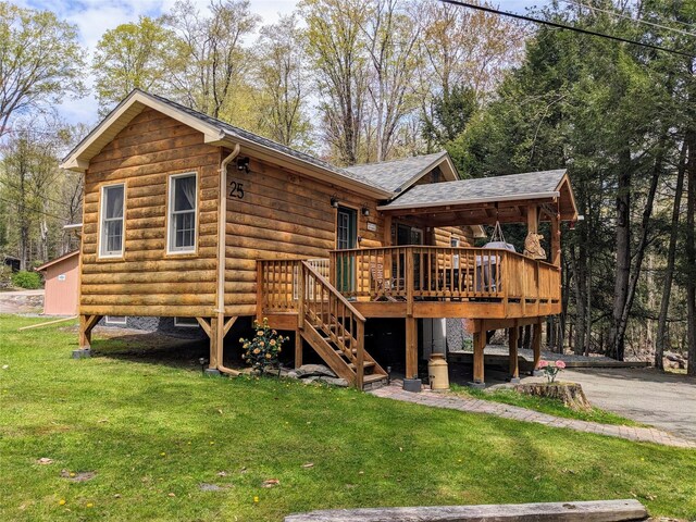 25 E Reindeer Trl, Bethel, NY 12778 - rear view of house with a deck, a lawn, aphalt driveway, a shingled roof, and stairs
