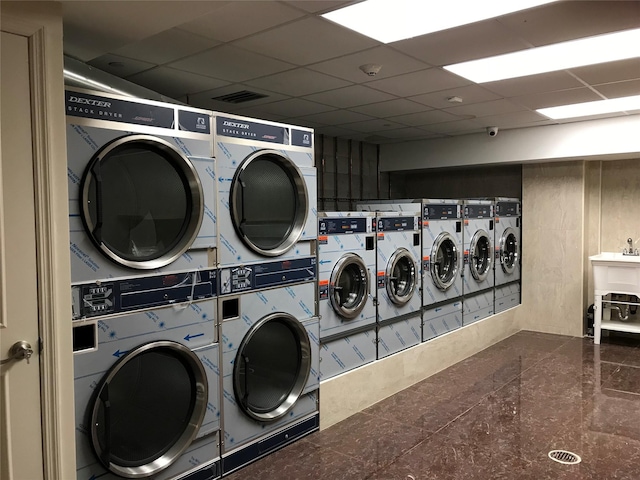 65-38 Austin St Unit 3B, Rego Park, NY 11374 - communal laundry room featuring stacked washing machine and dryer and washing machine and clothes dryer